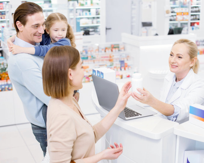 pharmacist and customers smiling