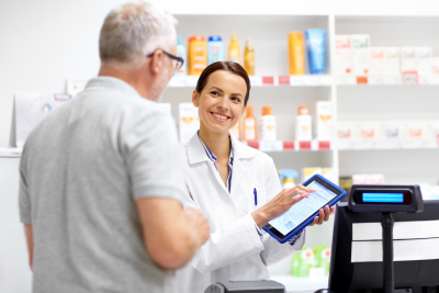 female pharmacist explaining the prescription medicine to the male customer