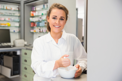 female pharmacist doing compounding